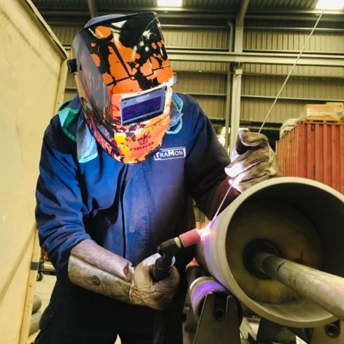 Auto-darkening, solar-powered welding helmet